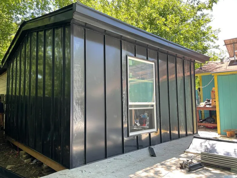 Black standing seam metal wall panels for Roof Inspection in Beacon Square