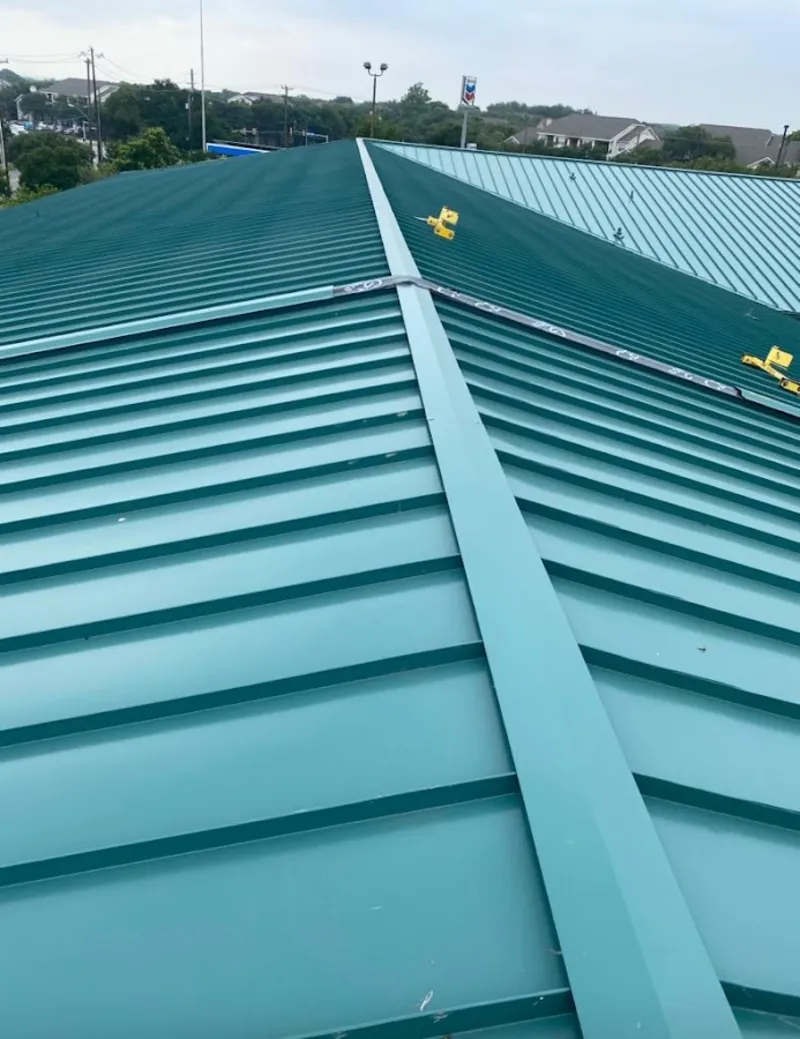 Green commercial metal roof ridge and valley for Metal Roof Repair in Beacon Square